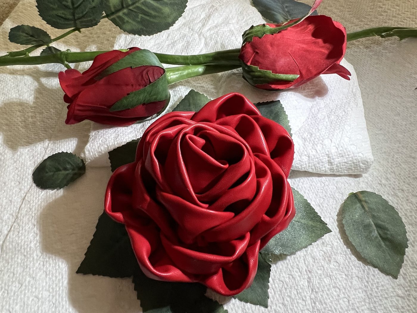 Handmade red satin ribbon rose